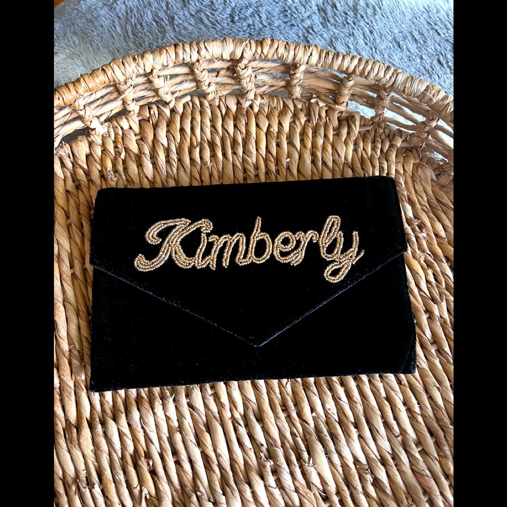 Velvet clutch with personalized gold beaded detail. NWT